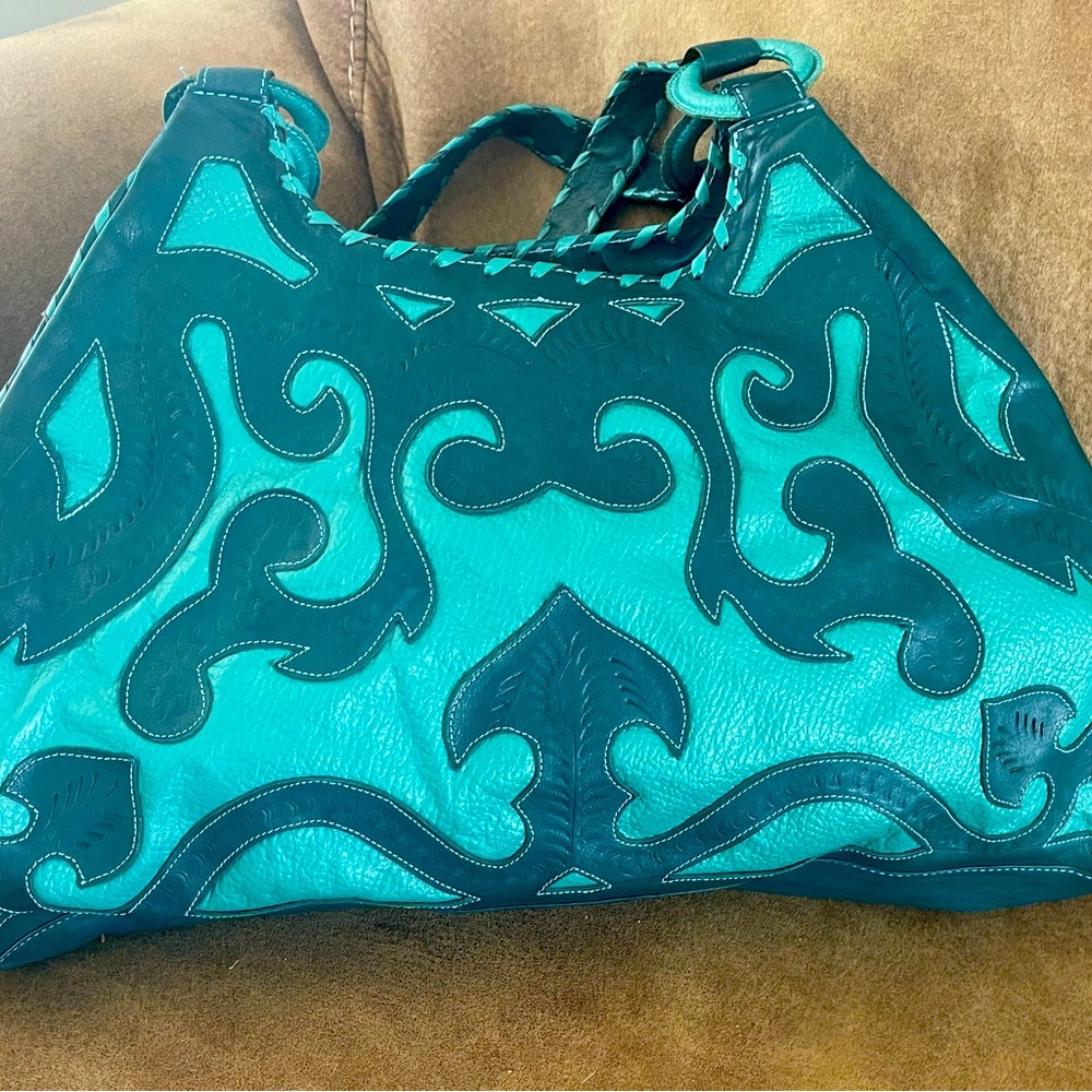 Leaders in Leather cut-out turquoise bag!